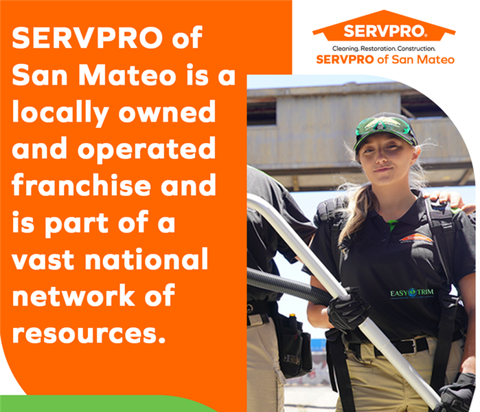 SERVPRO of San Mateo staff with cleaning equipment, emphasizing local ownership and national support.